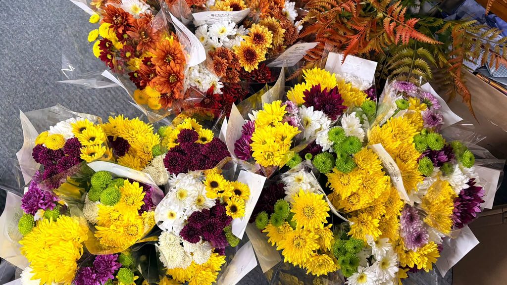 bright flower bouquets in wraps for Petal It Forward campaign
