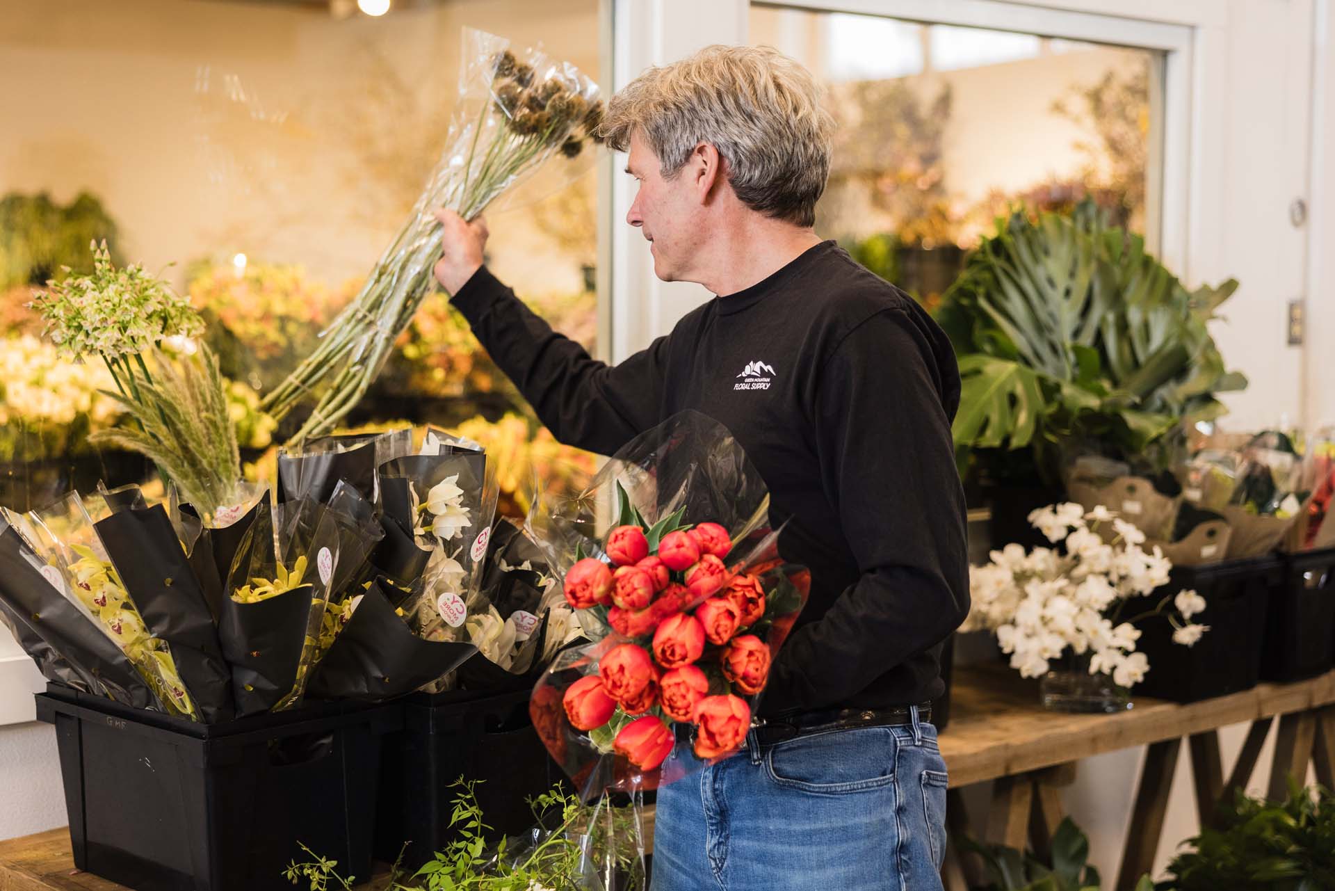 Tom picking out flower bunches